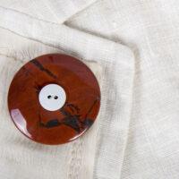 Jasper Mourning Button with a button of a loved one as a brooch on a summer jacket.
